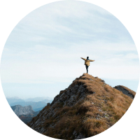Person standing on a mountain summit